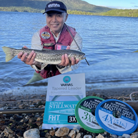 Angler with a trout and VARIVAS Master Spec II tippet